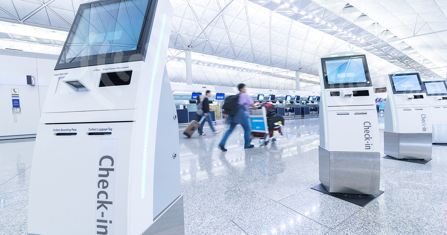 Self service machine and help desk kiosk at airport for check in, printing boarding pass or buying ticket