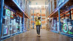 woman using IoT in warehouse