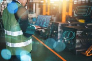 manufacturing worker using IoT device