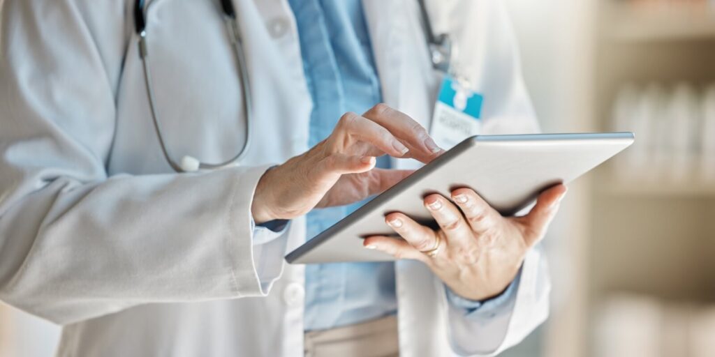 doctor, office and tablet for research, email or communication
