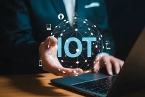 man holds glowing IoT network globe connecting devices and data for futuristic business