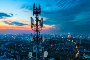 telecommunication tower with 5G cellular network antenna on city background