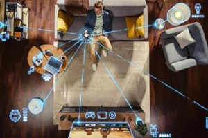 top view of caucasian man In the loft apartment sitting down on the couch and connecting smartphone to convenient smart home system